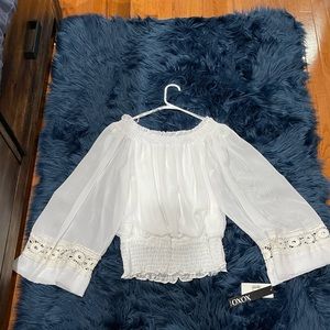 Brand new top, can be worn off the shoulders